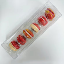 Load image into Gallery viewer, Packaged macarons in red and gold on a white background